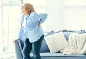 Back Injury Lawyers in Doraville | Free Consultations middle-aged woman with back injury