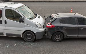 mini-van crashing into compact car