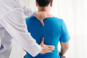 Back Injury Lawyers in Covington | Free Consultations physiotherapist doing healing treatment on a patient