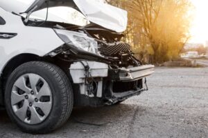 Uninsured Motorist Accident Lawyers in Clarkston white car with crashed front-end