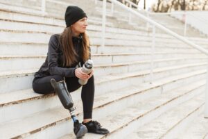Catastrophic Injuries Lawyers in Dublin | Free Consults woman sitting on steps with a prosthetic leg