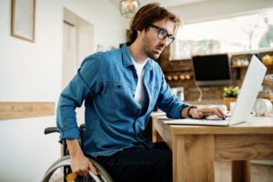 Catastrophic Injuries Lawyers in Cartersville young disabled businessman using laptop