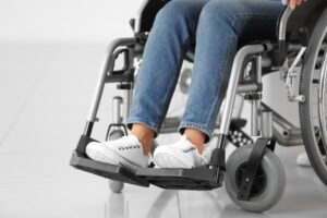 Catastrophic Injuries Lawyer in Johns Creek | Free Eval close-up on woman’s feet in wheelchair