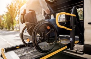 Catastrophic Injuries Lawyer in Locust Grove man in a wheelchair on a bus lift