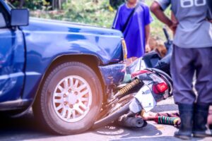 Motorcycle Accident Lawyer in Evans | Free Consults motorcycle with blue pickup in crash