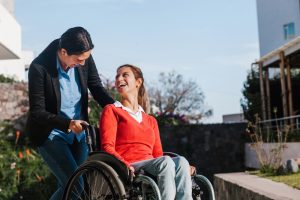 woman in a wheelchair with a friend