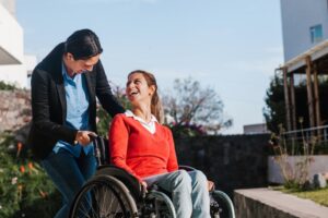 Catastrophic Injuries Lawyer in Loganville | Free Eval woman in a wheelchair with a friend