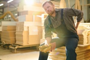 Back Injury Lawyer in Forest Park | Free Consults woodworker with back pain