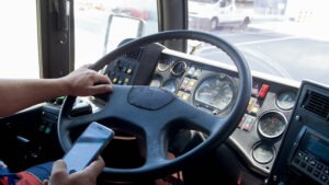 Bus Accident Lawyer in Norcross | Free Consultations bus driver texting while driving