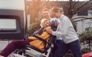Catastrophic Injury Lawyer in North Druid Hills | John Foy Associates aids helping woman into a van