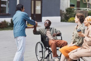 Catastrophic Injury Lawyer in Sugar Hill | Free Consult black-man-in-wheelchair-greeting-family