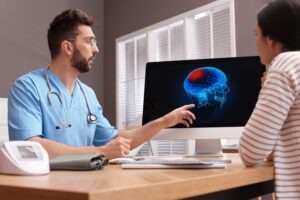 Traumatic Brain Injury Lawyer in Roswell | Free Consult neurologist going over brain scan with a patient