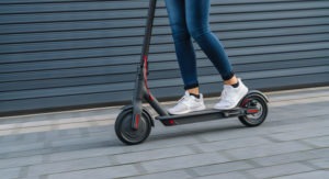 girl riding electric scooter