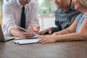 insurance adjuster talking to couple