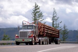 Logging Truck Accident Lawyer in Atlanta | Free Consult logging truck driving down the road