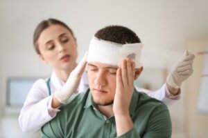 Atlanta Head Injury Workers' Compensation Lawyer man in hospital with head injury