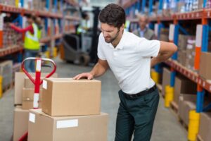 Atlanta Back Injury Workers’ Compensation Lawyer man with back injury and handcart