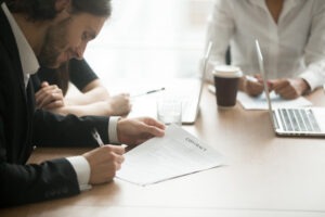 lawyer taking notes during a deposition