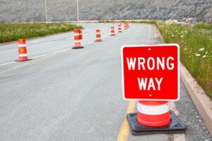 red white wrong way road sign