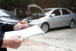 insurance officer agent working on crash