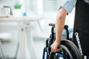 close-up on man’s arm in wheelchair