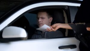 cop giving young man a ticket