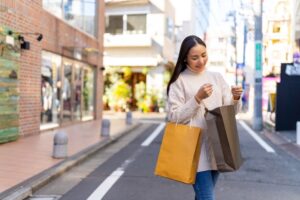 young woman with shopping bags