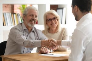 clients smiling with attorney