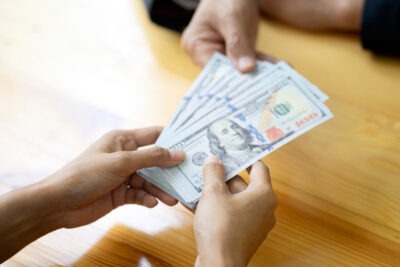 Person receiving compensation scaled