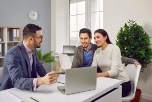 couple working with insurance agent