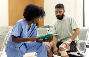 Injured man talks to nurse after UPS work accident