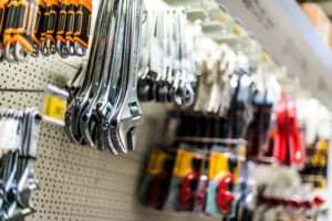 tools hanging on a pegboard display in a hardware store