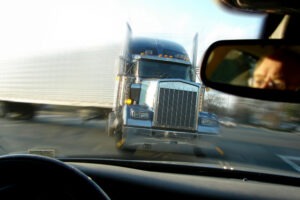 a tractor-trailer truck coming toward another vehicle just before an accident