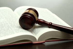 Gavel on a lawbook. An Atlanta personal injury attorney can help you with defense against the Georgia avoidable consequences doctrine.