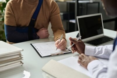 Lawyer meets with client to explain why their workers’ compensation case is taking longer than expected.