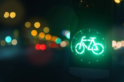 Does Car Insurance Cover Bicycle Accidents? | John Foy Bicycle green sign on traffic light road. Does car insurance cover bicycle accidents?