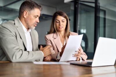 Georgia Work Injury Claims: Statutes, Liability and Damages A man consulting a lawyer. Learn about Georgia work injury claims: statutes, liability, & damages