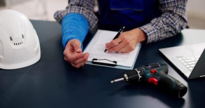 Injured Outside of Work: Does Workers' Compensation Apply? Worker filling out an insurance form and wondering when workers’ compensation applies if you’re injured outside of work.