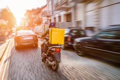 What if I'm Injured While Driving for DoorDash? A food deliveryman riding a bike. What if I’m injured in an accident while driving for DoorDash?