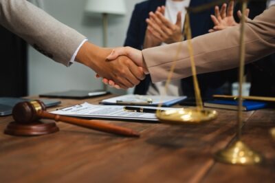 What Is Workers' Compensation Mediation in South Carolina? Two people shake hands after workers’ compensation mediation in South Carolina.