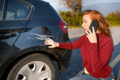 What Should I Do After a Minor Car Accident? | John Foy Woman calling insurance after car crash. What should I do after a minor car accident?