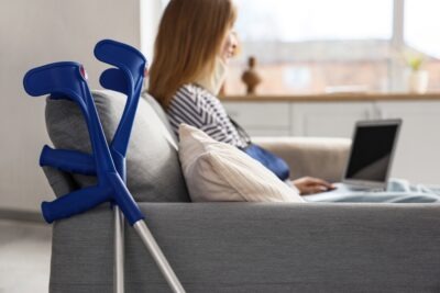 An injured federal employee using her laptop to research how long she can stay on federal workers' compensation.