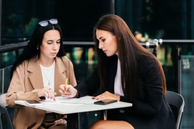 How Long Do You Have to Approve a Settlement Offer? Lawyer reviewing a settlement proposal with their client and explaining how long they have to accept a settlement offer.