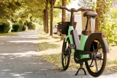 An e-bicycle resting upright on its kickstand, leaving the owner to wonder about what to do after an electric bike accident.