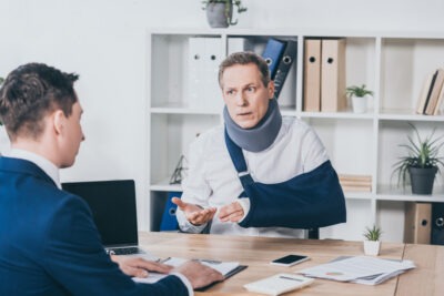 An injured employee discusses his right to PTO with a workers’ compensation lawyer.