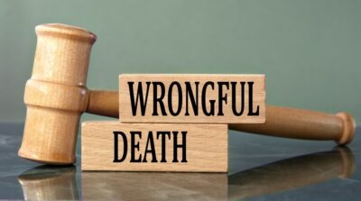 A wooden gavel rests near a plaque that reads “wrongful death.” How do you prove wrongful death? Call John Foy & Associates to speak with an Atlanta wrongful death lawyer.